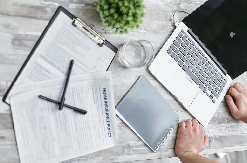An image of a person reviewing car insurance quotes on a laptop — car insurance in Nevada