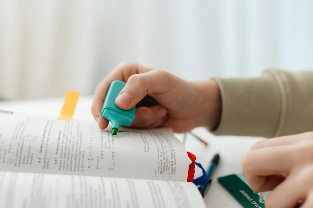 An image of a student studying with a car insurance policy in hand, highlighting good student discounts. — car insurance…