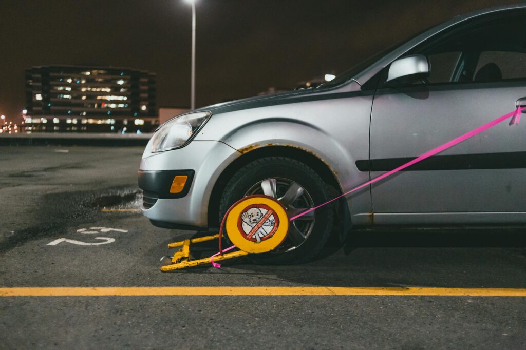 Image of a locked car in a parking lot at night, highlighting security measures related to car theft prevention tips Nevada.
