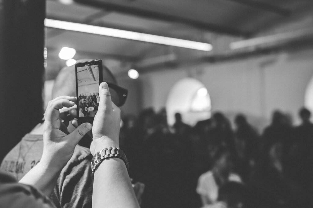 Photo of a person documenting the scene with a smartphone. — Nevada car accident insurance guide