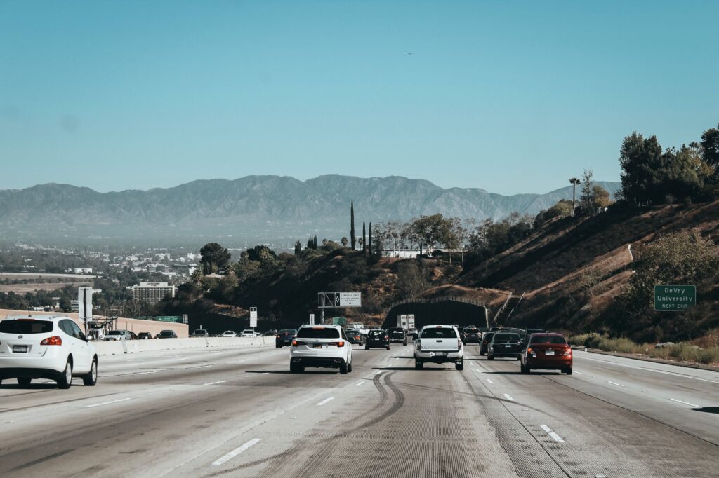 A photo of a Nevada highway with cars, illustrating common driving conditions. — Nevada no-fault insurance