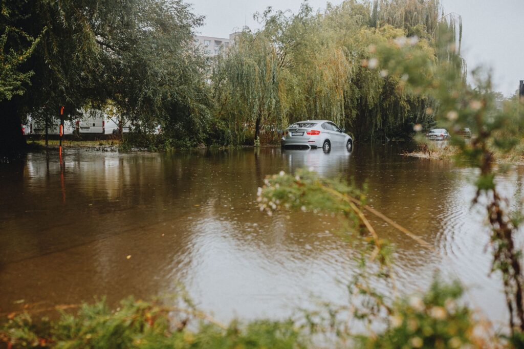 A photo of a flooded road in Nevada, highlighting the risks associated with weather-related claims. — Nevada weather car…
