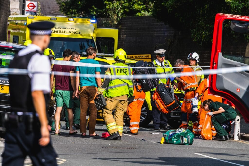 A photo showing a car accident scene with police and emergency responders present. — car accident insurance Nevada