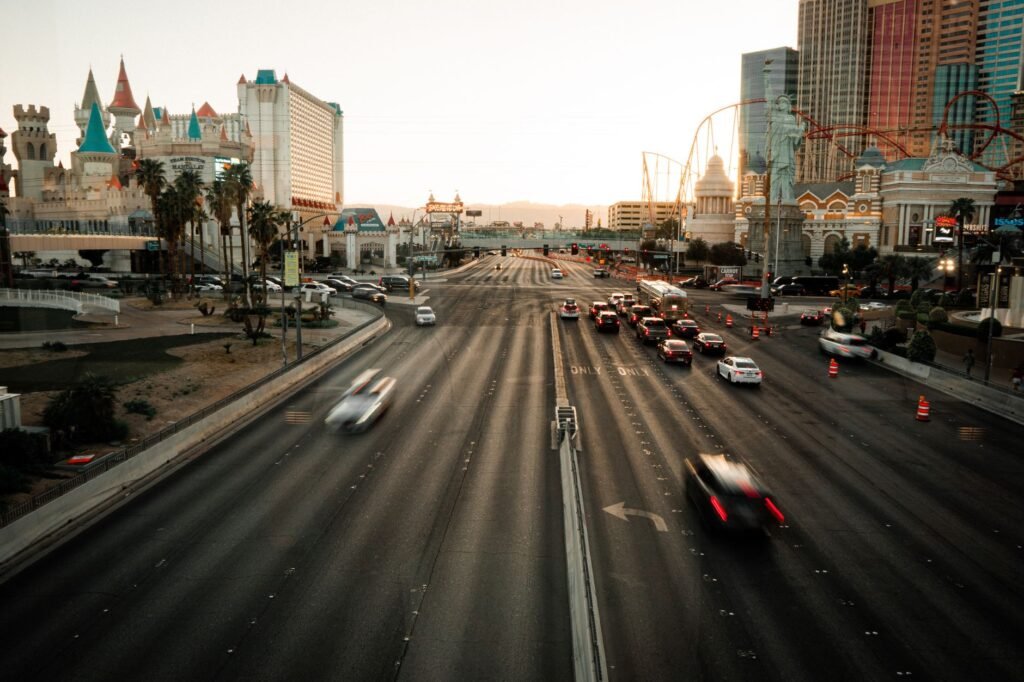 A photo of a Nevada highway with car insurance logos superimposed. — best car insurance companies Nevada