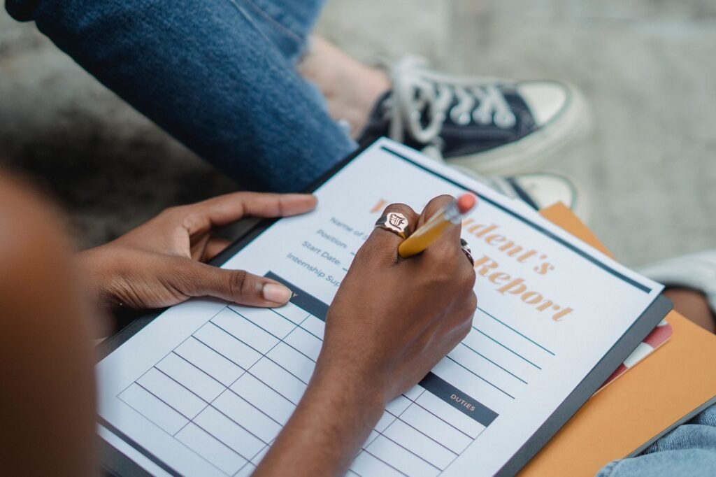 A student showing their report card, symbolizing good student discounts. — Nevada car insurance discounts