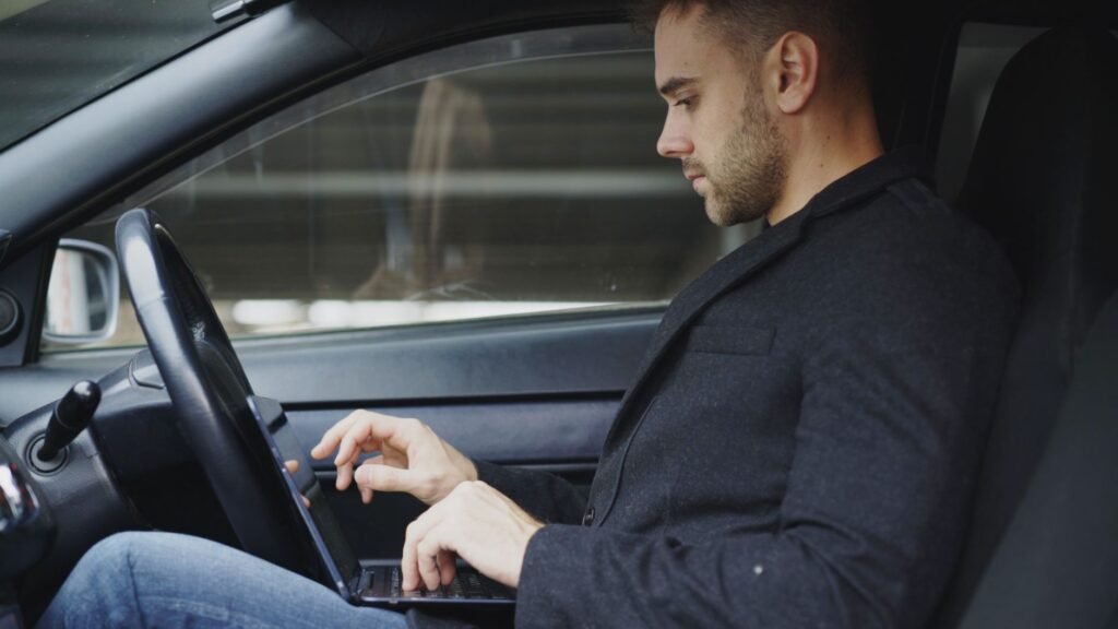 A young driver reviewing car insurance options on a laptop. — car insurance young drivers Nevada