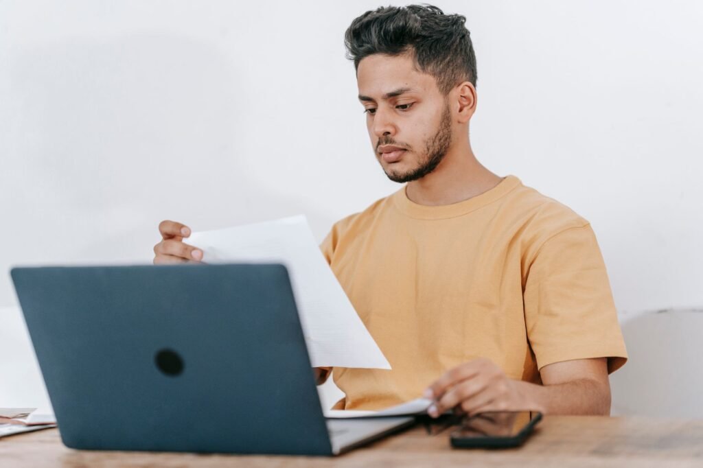 Image of a person checking their credit report online — credit score car insurance Nevada