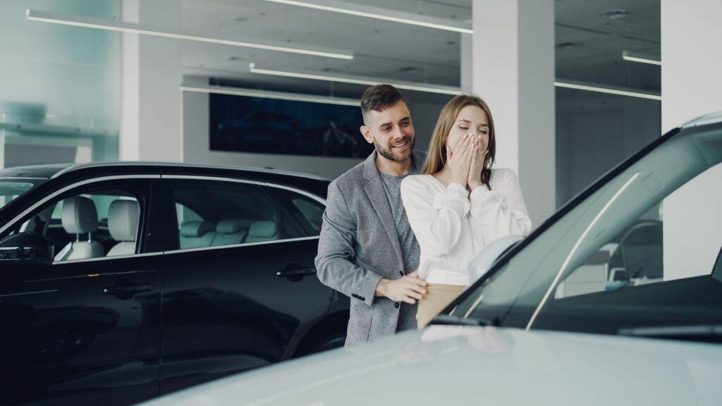 A photo of a happy family with their car, symbolizing peace of mind with affordable car insurance. — affordable car insu…