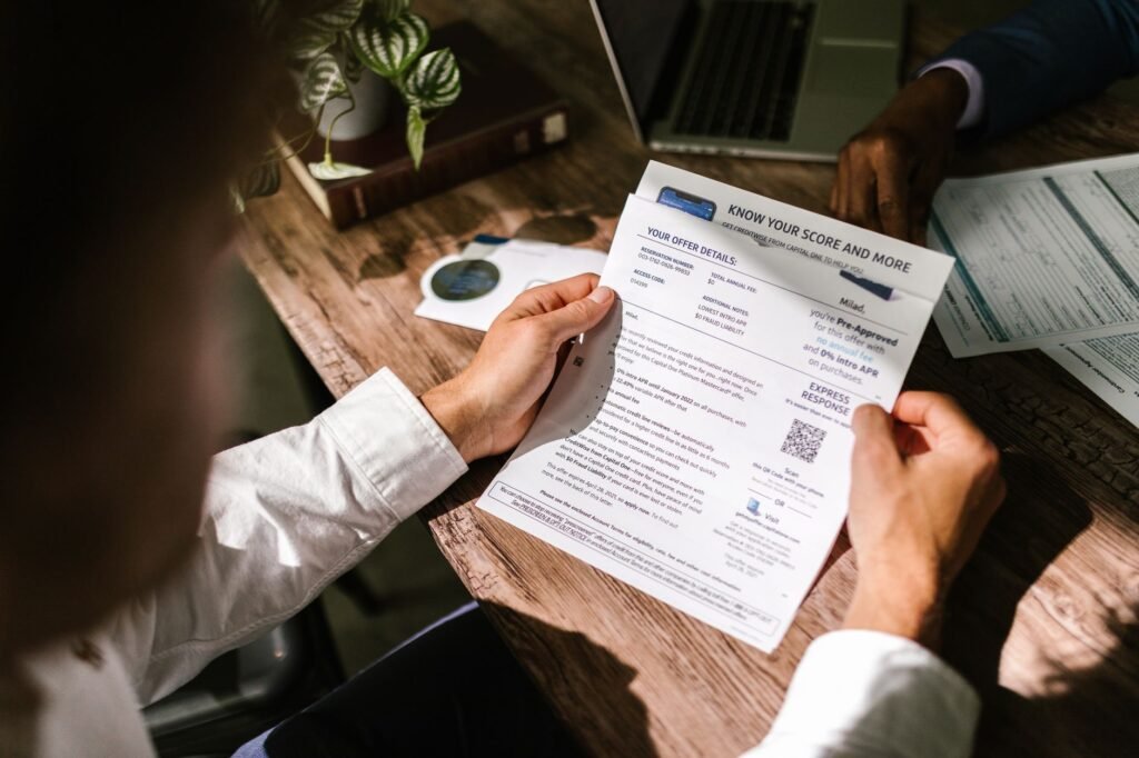 An image of a person reviewing their credit report related to credit score car insurance Nevada