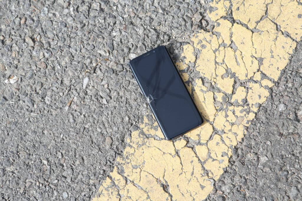 Image of a person documenting an accident on their phone, after car accident Nevada