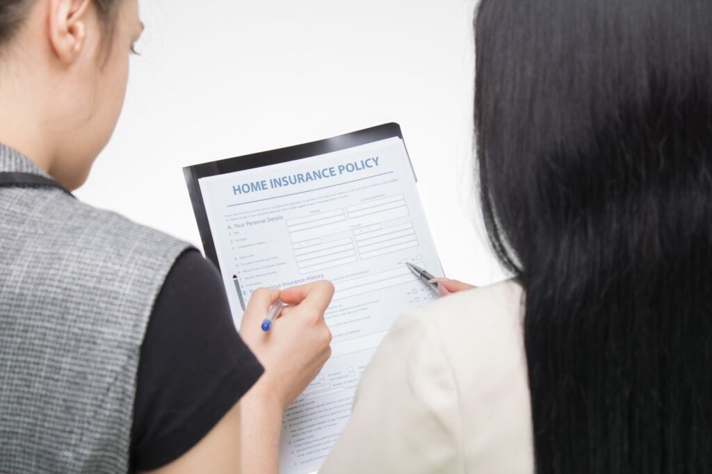 A photo of a person reviewing car insurance documents at home. — best car insurance in Nevada